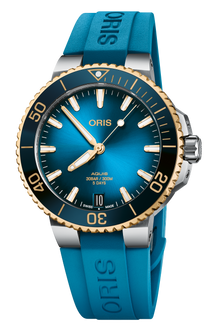Aquis Date Calibre 400, 41.50 mm, Blue, Rubber Strap, Stainless steel screw-in security crown, Multi-piece stainless steel case, 18K yellow gold turning top ring, ceramic minutes scale top ring