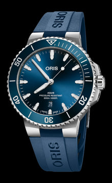 Aquis Date, 43.50 mm, Blue, Rubber Strap, Stainless steel screw-in security crown, Multi-piece stainless steel case, ceramic minutes scale top ring